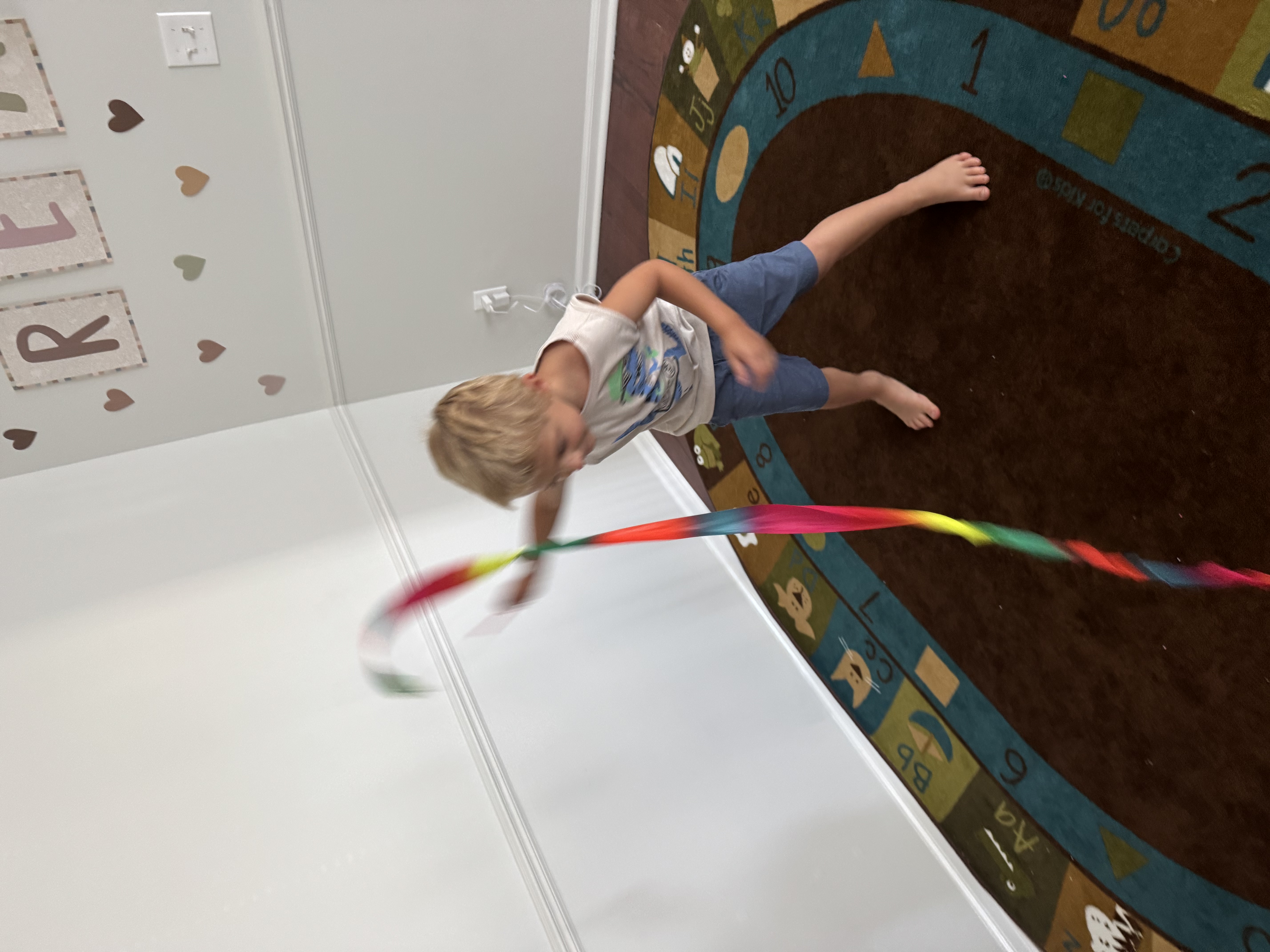 Child playing with rubberband toy